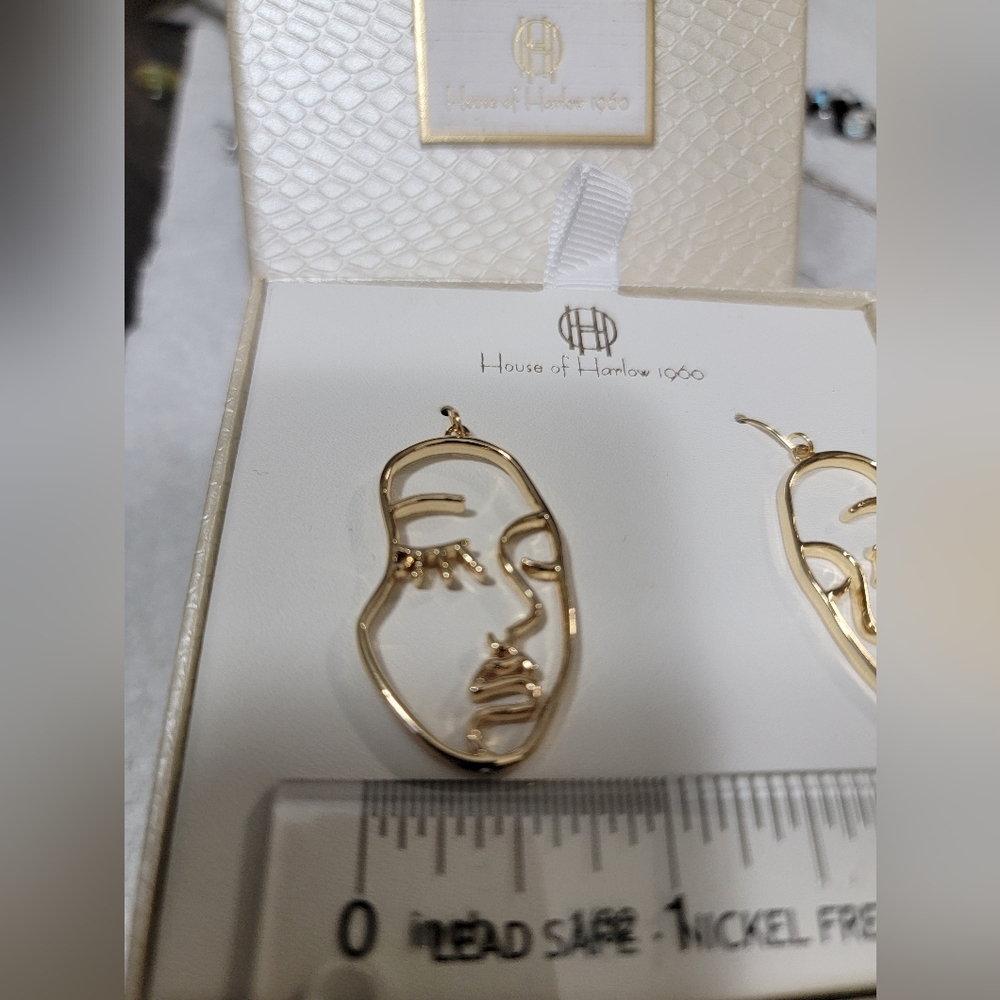 Abstract gold face earring